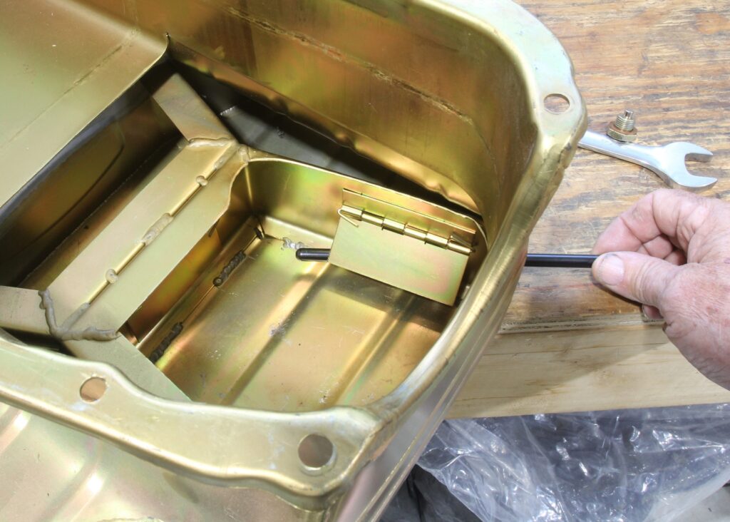 Opening trap door on Milodon oil pan for small Chevy
