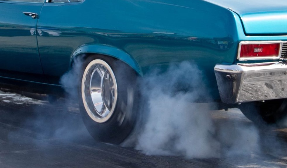 close up of a smoking tire during a burnout