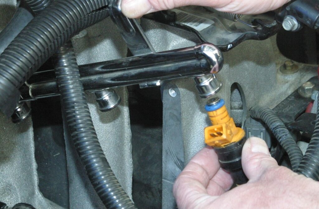 Installing fuel injector on fuel rail